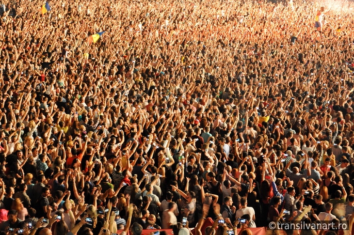 Party crowd dancing at concert