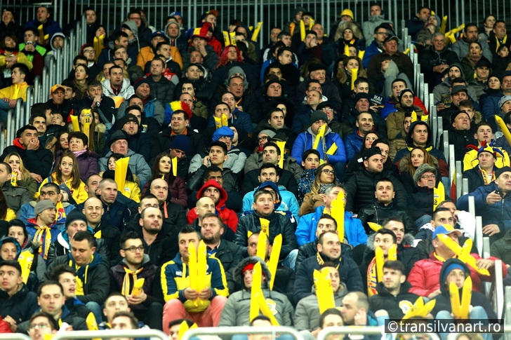 Crowd of people, supporters in a stadium during a football match